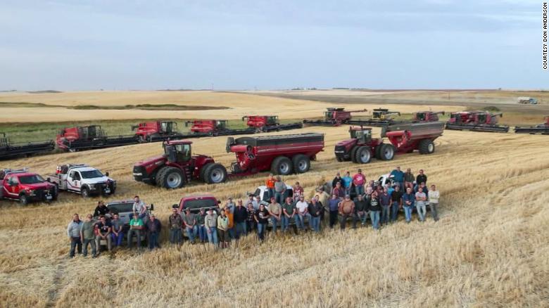 Around 60 neighbors, friends and family of a North Dakota farmer harvested his wheat and canola after the farmer suffered a heart attack during harvest.